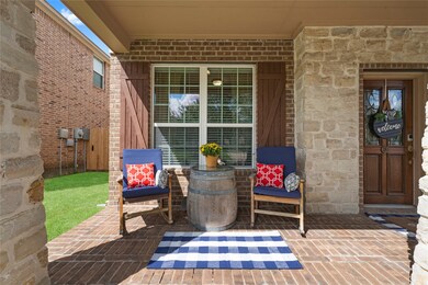 In addition to the covered living space in the backyard, this house also features a spacious front porch that can be utilized to create a comfortable sitting area.