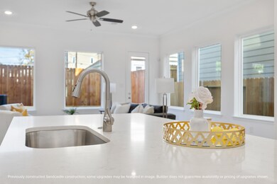 Oversized windows line the back wall, filling your