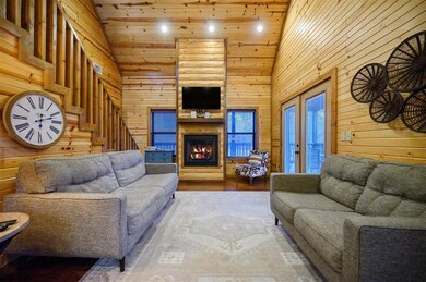 Living room with high vaulted ceiling, wood ceilin