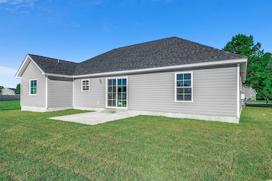 Back of house featuring a patio and a yard