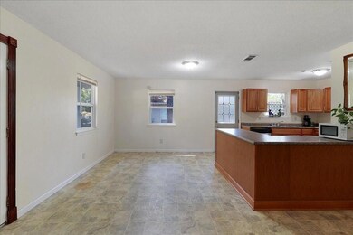 Spacious Dining area with door to side and rear ya