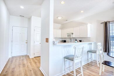 Kitchen with kitchen peninsula, a textured ceiling
