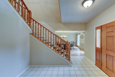 Tiled entry and tiered staircase.