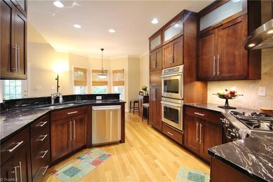 Updated kitchen! Stainless steel appliances & fixtures, lots of cabinet storage. Professional gas cooktop with exhaust fan, plus double oven!