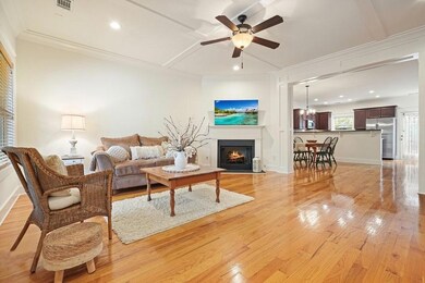 Massive Living Room with gleaming hardwoods throughout main level