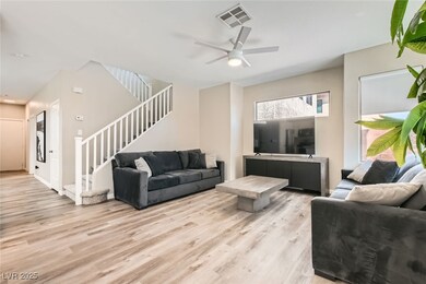 Living room featuring light wood-style flooring, s
