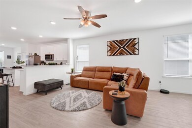 This spacious living room features high ceilings,