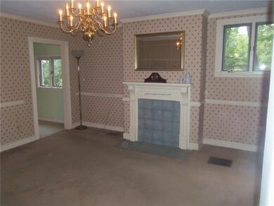 Formal dining room features crown molding and chai