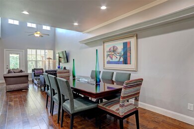 A spacious dining room, kitchen, and living room f