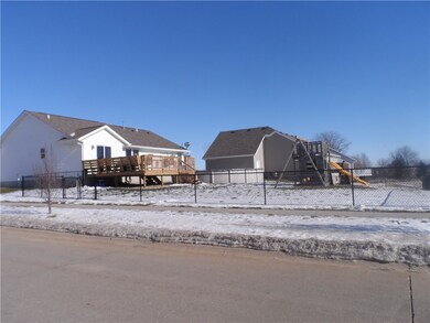 Fenced yard with playset, large deck with built-in