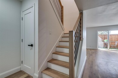 Come to your Entry featuring coat closet, hardwood
