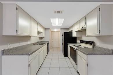 The galley-style kitchen is thoughtfully designed