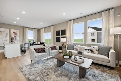 (Photo of a decorated model, actual homes colors and finishes will vary) Each room on the main level flows perfectly to the next.