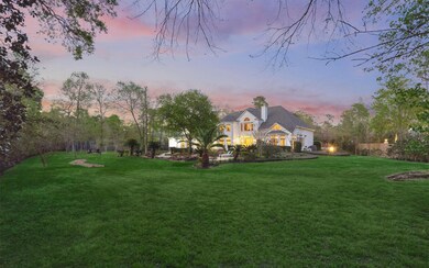1.13 Acres with extensive grassy areas & wall of windows across back of home overlook the estate.