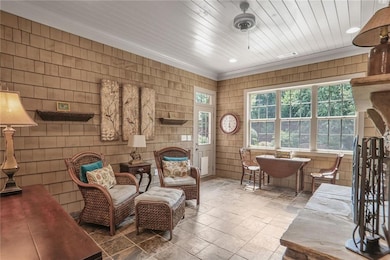 Rear Sunroom featuring ornamental molding