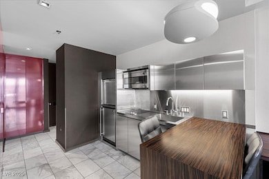 Kitchen with appliances with stainless steel finis