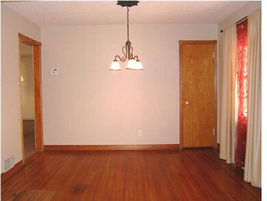 THE FORMAL DINING ALSO HAS HARDWOOD FLOORS.
