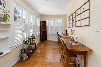 Sunroom at front of house with plantation shutters