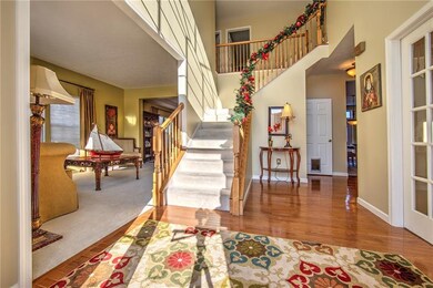 Grand entry with elegant stairway...