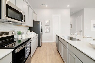 Kitchen featuring stainless steel appliances, a s