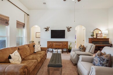 Buy the biggest TV you can afford; there's plenty of wall space. The hall to the left of the TV leads to the primary bedroom. Looking from the kitchen to the living room.