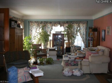 Dining Room section of Living Room with Bay window.