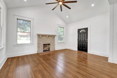 Unfurnished living room featuring a fireplace, har