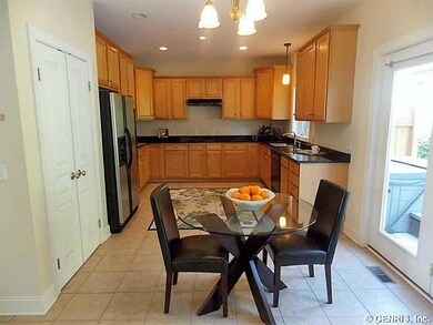 Kitchen Dining. Dining area opens to family room &