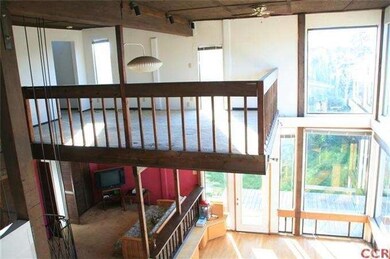 View of upstairs loft/lounge open to the dining ro