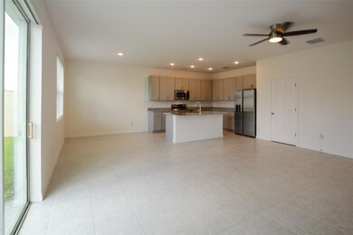 Family Room to Dinette and Kitchen View with a Pantry