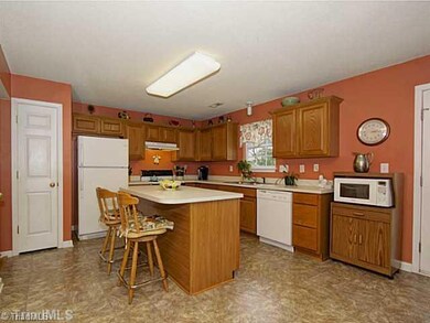 Kitchen. You ll enjoy cooking in this kitchen with pantry, center island and window over the sink with a view of this gorgeous yard!