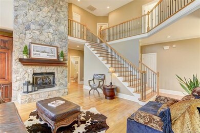 2 story great room features floor to ceiling stone