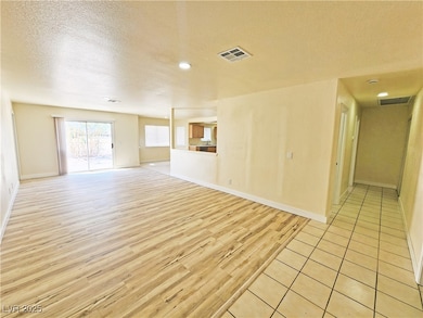 Unfurnished living room featuring light wood-style