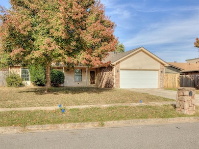 View of front of house with concrete driveway and a garage