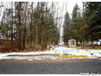 Exterior Front. Oswego River Road entrance leads t