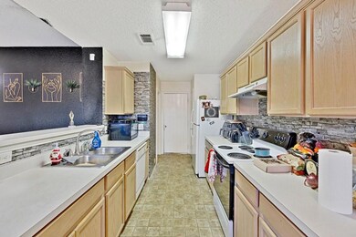 Kitchen with visible vents, under cabinet range ho