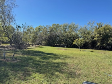 Grassy lot with trees