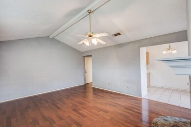 Empty room featuring lofted ceiling with beams, ce