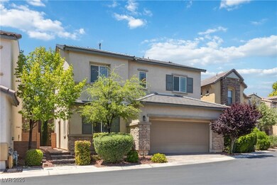 Traditional-style home with stucco siding, stone s