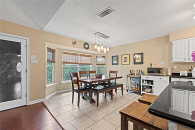 Dining Area with bay window open to Kitchen