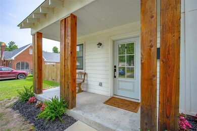 Property entrance with covered porch