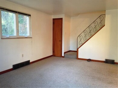 View of living room as you enter the front door.