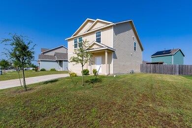 View of front of home with concrete driveway, a g
