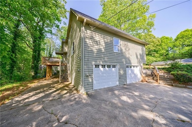 View of home's exterior featuring a wooden deck, d