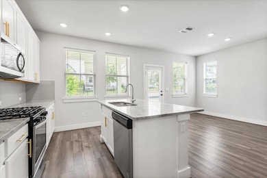 Kitchen featuring appliances with stainless steel