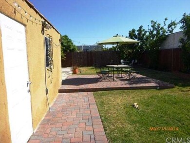 Mid yard has newer custom brick patio for entertai