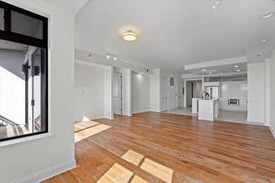 Unfurnished living room with a sink, light wood-ty