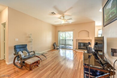 Living room w/gas fireplace and 
 wood flooring