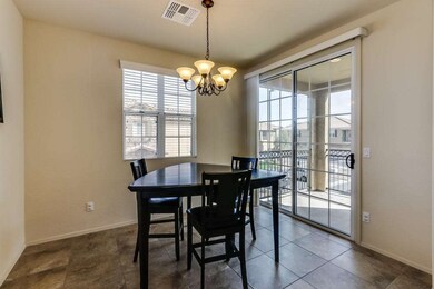 Dining Room w/ Doors to Balcony