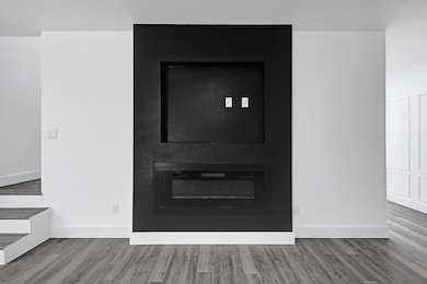 Statement black feature wall with built-in firepla